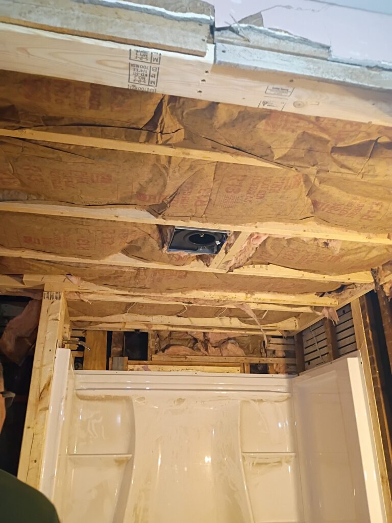 Ceiling framing and insulation above the tub