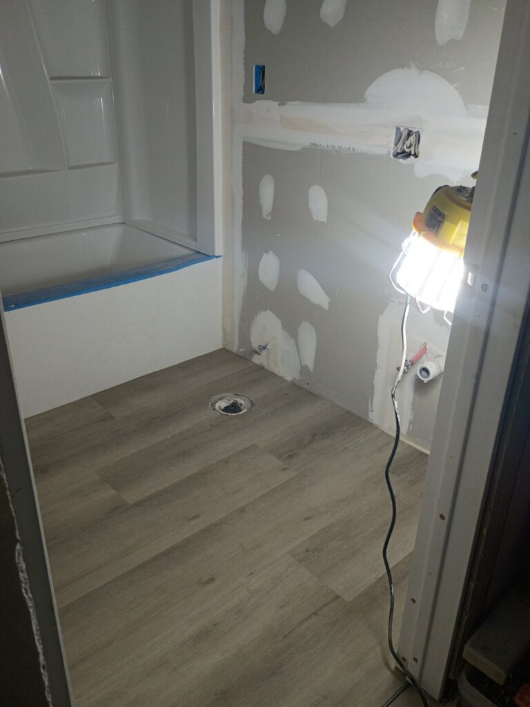Flooring installed and walls being finished