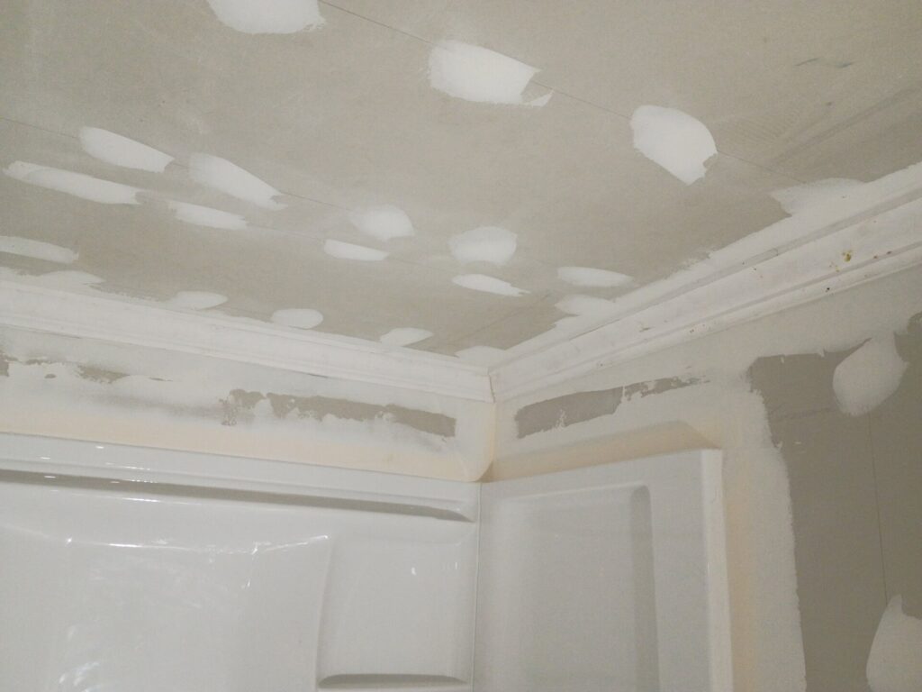 Drywall finishing around the shower ceiling