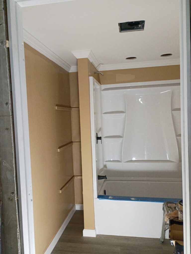 Paint, trim and the tub surround