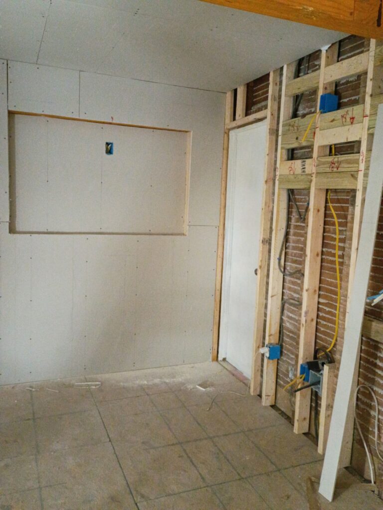 Framing and drywall around the television recess