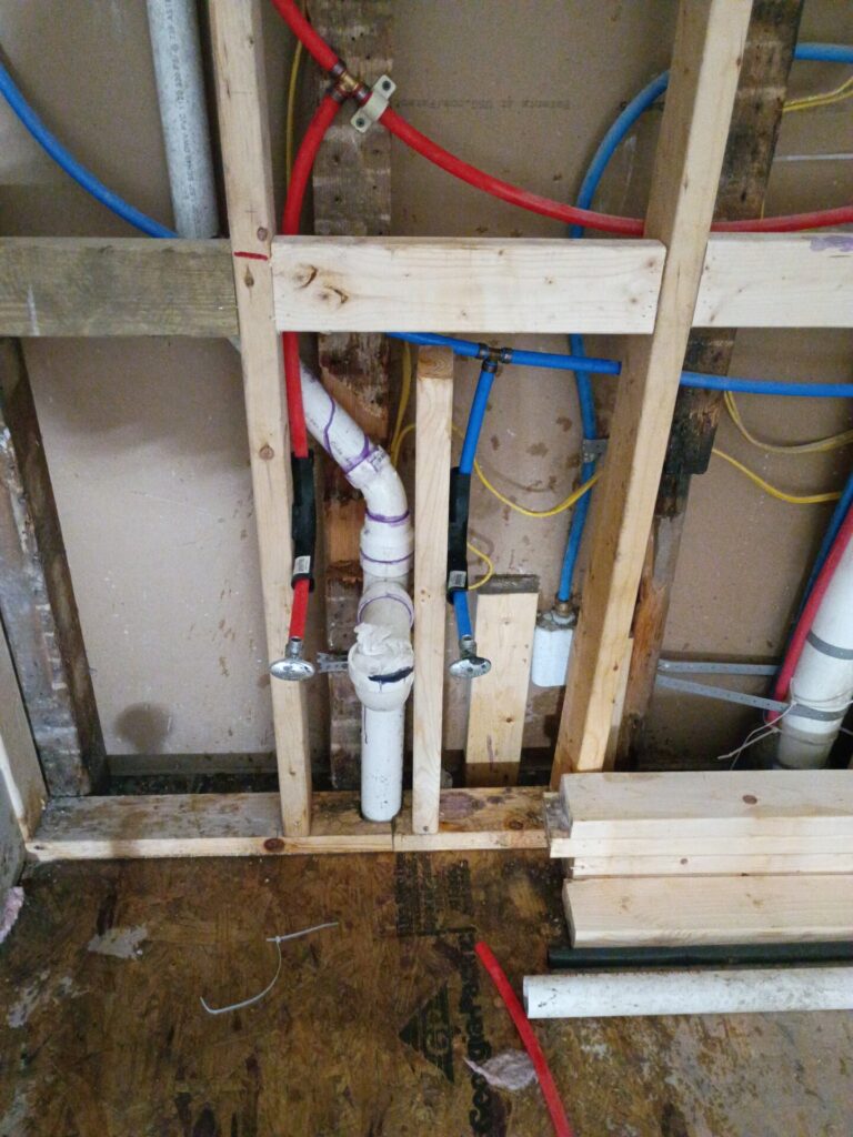 Supply lines and drain inside the open wall