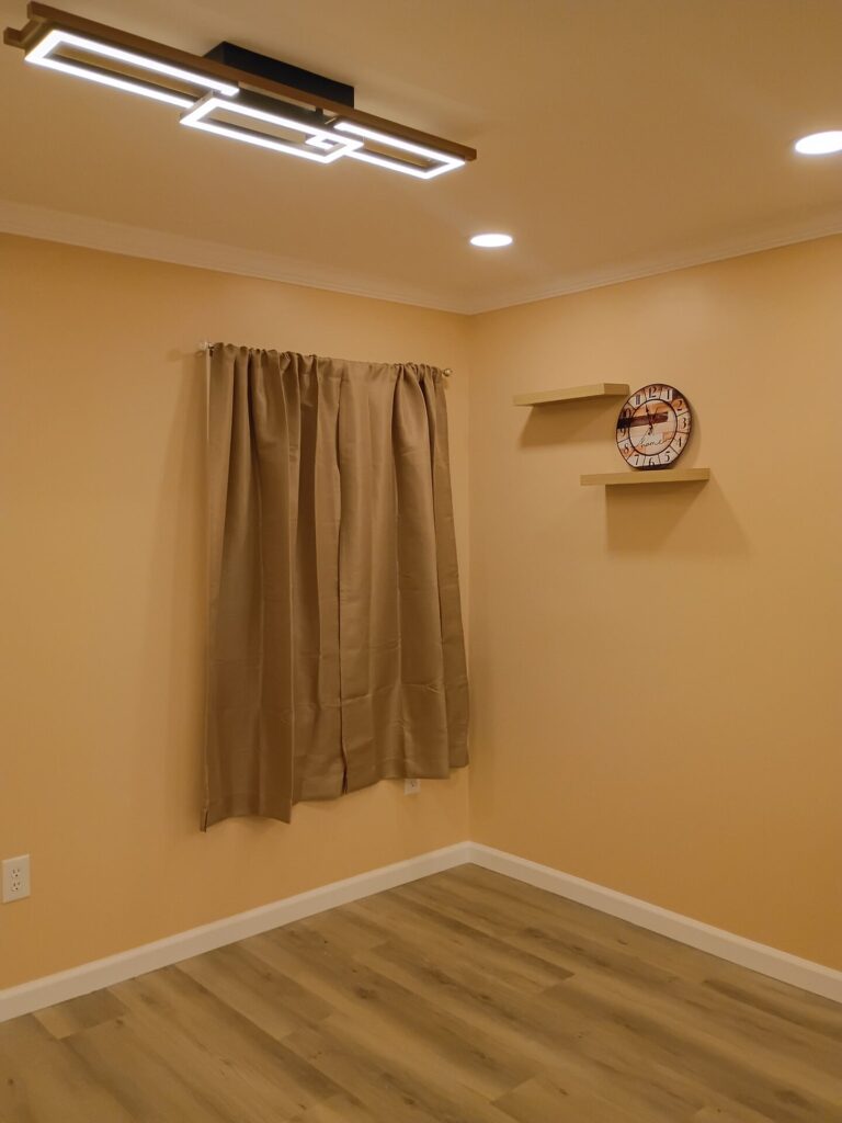 Finished room corner with floating shelves