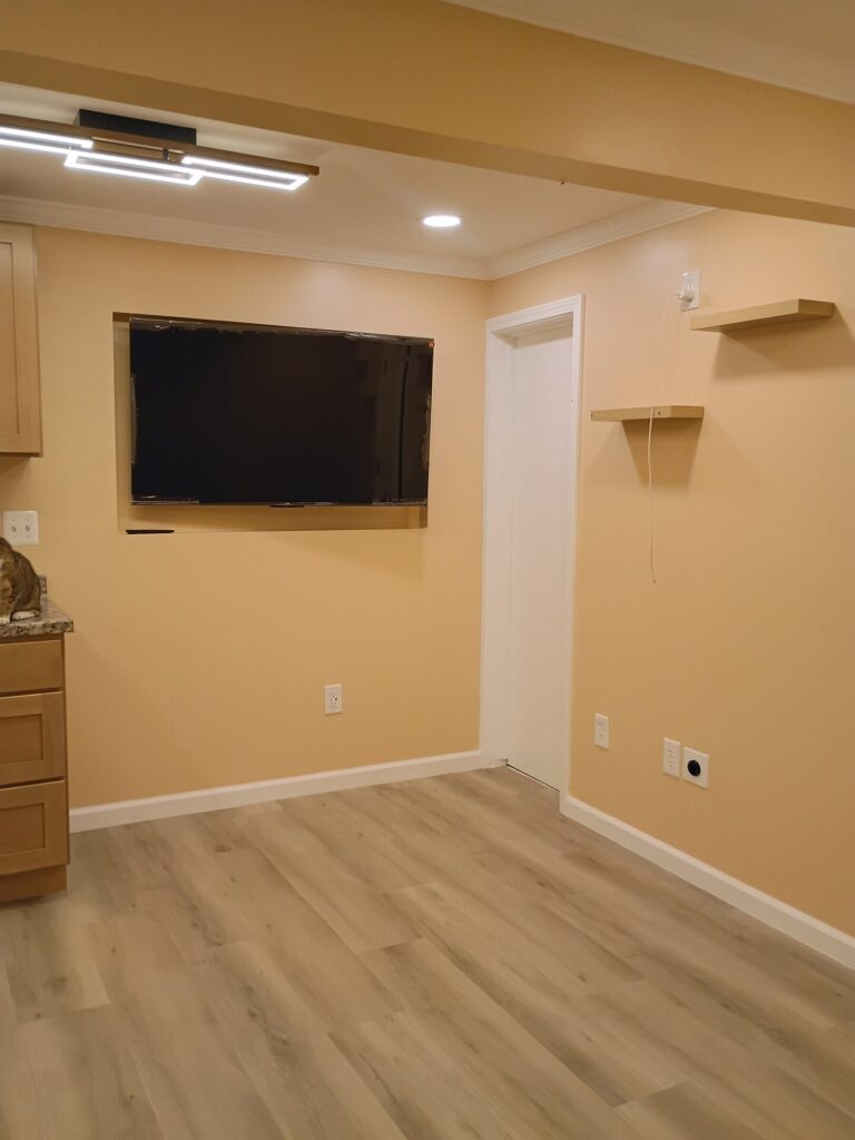 Recessed television area and finished flooring