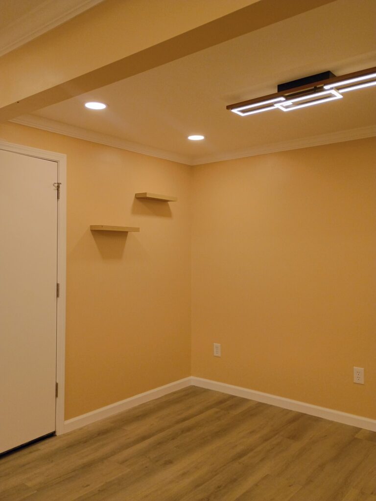 Finished walls, trim and wood-look floor